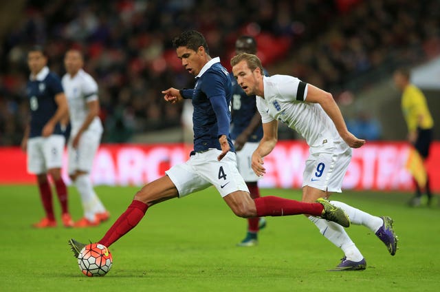 Varane (left) helped France win the 2018 Word Cup (Nick Potts/PA).