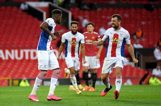 Crystal Palace’s Wilfried Zaha, left, celebrates scoring at Manchester United