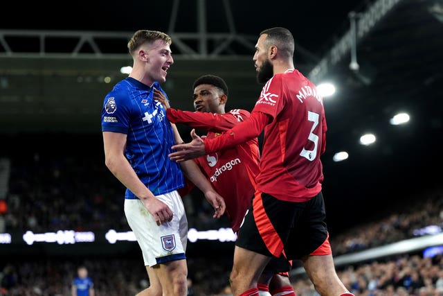 Manchester United’s Noussair Mazraoui (right) reacts after a challenge from Ipswich Town’s Liam Delap