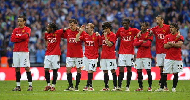 Manchester United’s Dimitar Berbatov is dejected after he missed his penalty