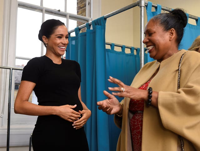 Meghan talks with Patsy Wardally after helping her put together an outfit. Clodagh Kilcoyne/PA Wire