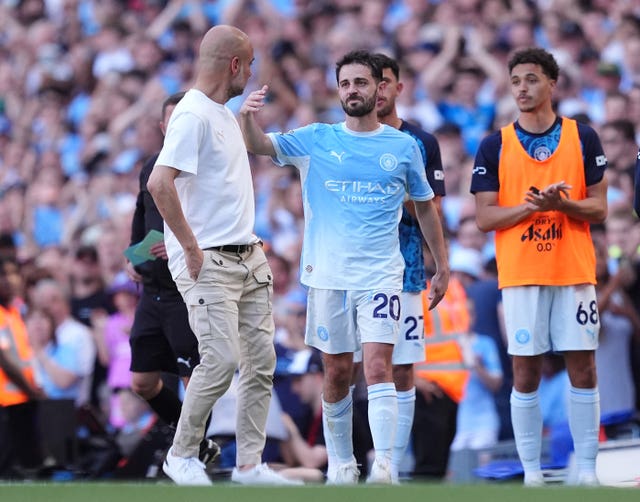 Bernardo Silva embraces Pep Guardiola after being substituted