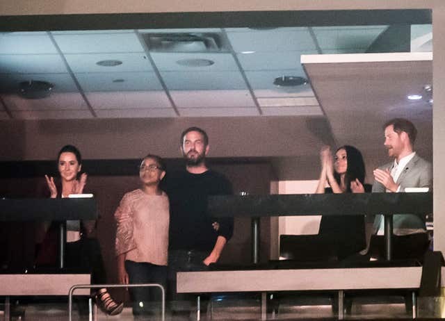 Prince Harry (right) and Meghan Markle (2nd right), with Jessica Mulroney, Meghan’s mother Doria Ragland and Markus Anderson during the Invictus Games Closing Ceremony (PA)