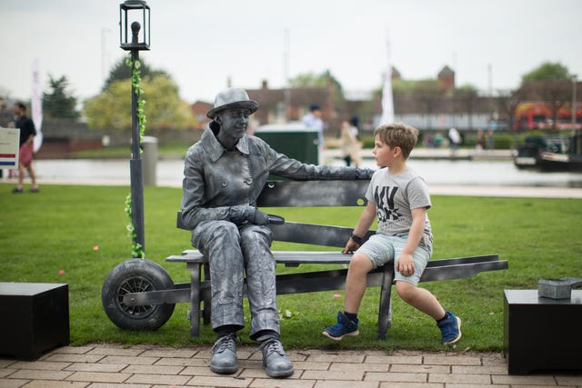 A young boy watches Dutch performer Ye Olde Bench  (Aaron Chown/PA)