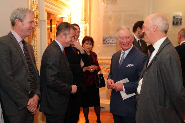 The Prince of Wales is joined by Charles Saumarez Smith, right, secretary and chief executive of the Royal Academy, as they meet directors of various institutes who have loaned art for the exhibition (Andrew Matthews/PA)