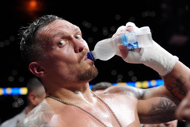Oleksandr Usyk drinks water after beating Daniel Dubois