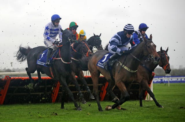 Koshari (left) on his way to victory at Aintree