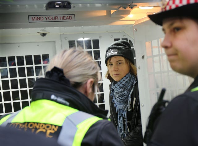 Greta Thunberg in a police van after being detained