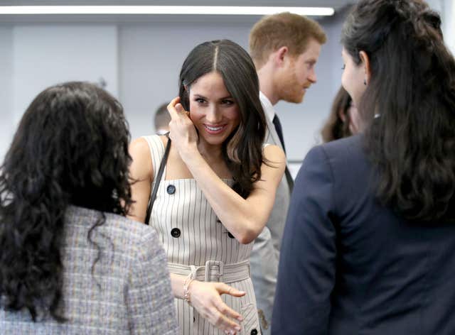 Ms Markle chats to delegates at the Youth Forum (Yui Mok/PA)