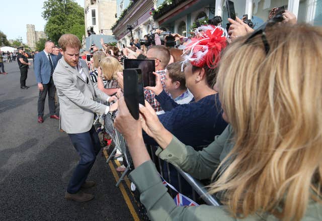Prince Harry met members of the public outside Windsor Castle the day before his wedding (Jonathan Brady/PA)