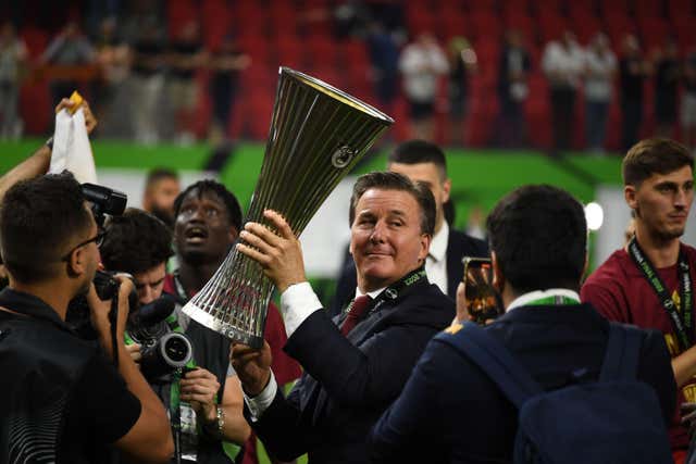 Roma owner Dan Friedkin with the Conference League trophy (PA)