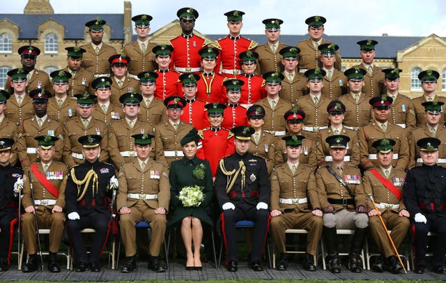 The royals posed for a formal photo with the battalion 