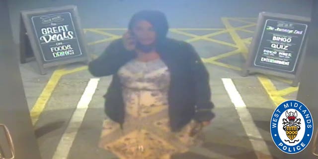 Aimee Betro captured on CCTV speaking into a phone
