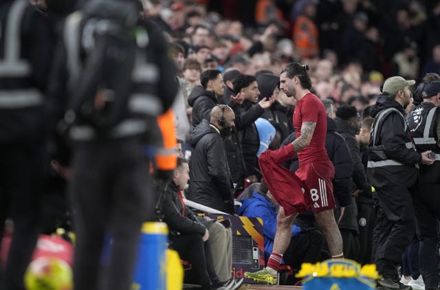 Dominik Szoboszlai walks down the tunnel after being sent off 