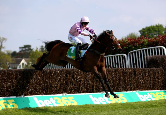 Greaneteen, ridden by jockey Harry Cobden, clears a fence on their way to winning the bet365 Celebration Chase last year