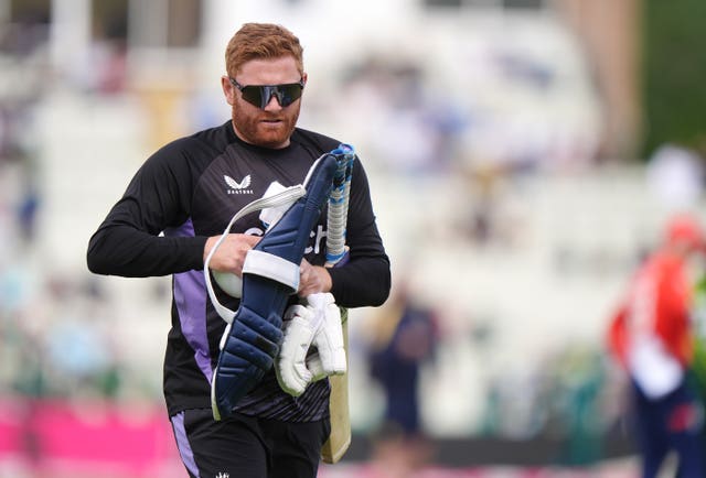 Jonny Bairstow wears sunglasses as he walks away from a net session with his pads.