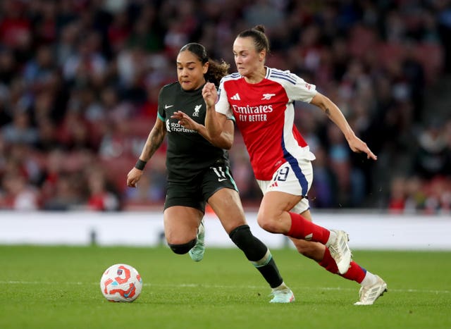 Liverpool’s Olivia Smith, left, and Arsenal’s Caitlin Foord battle for the ball