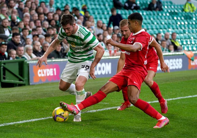 Celtic’s Anthony Ralston (left) battles for the ball with AZ Alkmaar’s Dani de Wit (back) and Zakaria Aboukhlal during the UEFA Europa League Play-off, first leg match at Celtic Park, Glasgow