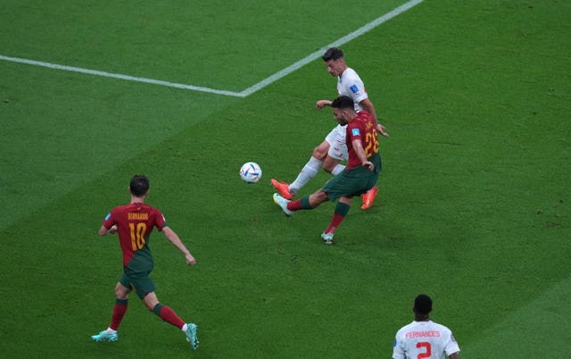 Goncalo Ramos, centre, scores Portugal’s first goal