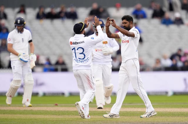 Sri Lanka’s Prabath Jayasuriya (right) celebrates dismissing Chris Woakes