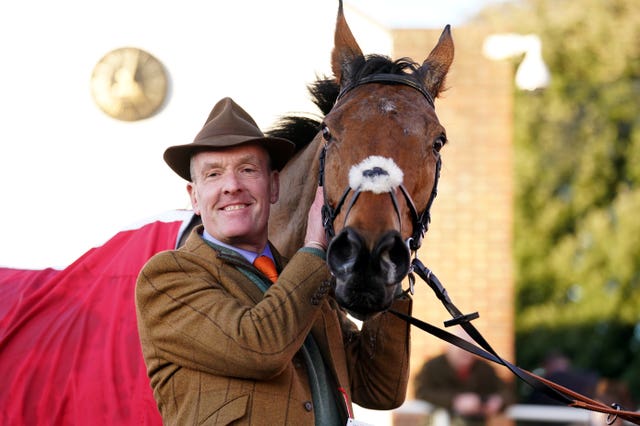 Owner Bryan Drew celebrates winning  the Ladbrokes King George VI Chase with Bravemansgame