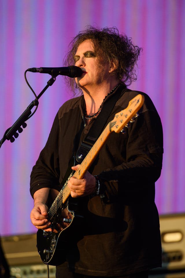 The Cure frontman Robert Smith playing guitar