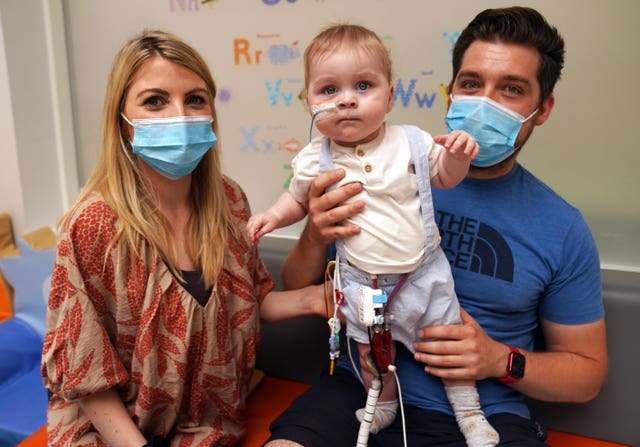 Cillian Myles and partner Lesha Comer, from Galway, Ireland, with their one-year-old son Luke on Ward 23 at the Freeman Hospital in High Heaton, Newcastle Upon Tyne, who is in need of a heart donor