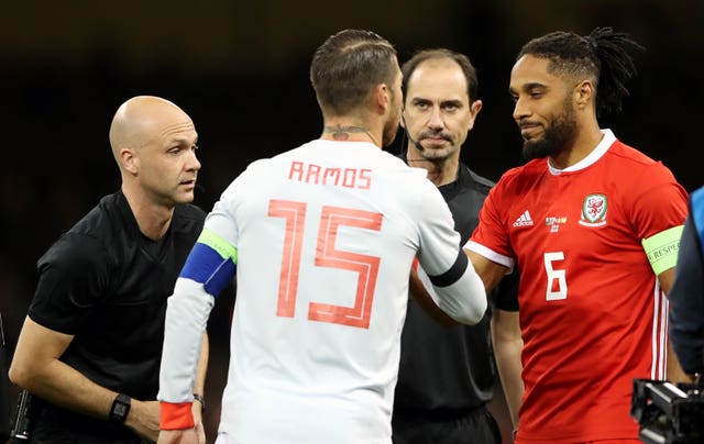 Ashley Williams will continue to wear the captain's armband for Wales