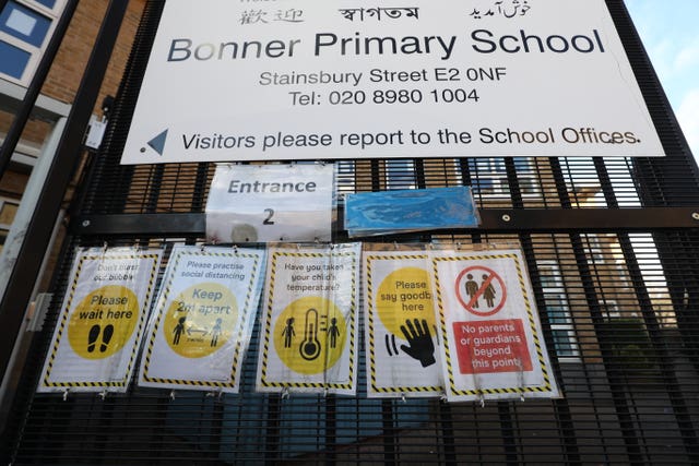 Signs outside Bonner Primary School in Tower Hamlets, east London, give advice about precautions to prevent the spread of coronavirus 