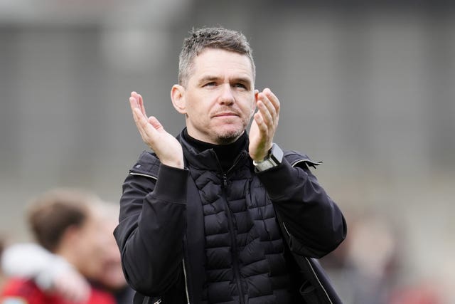 Manchester United Women boss Marc Skinner claps the fans