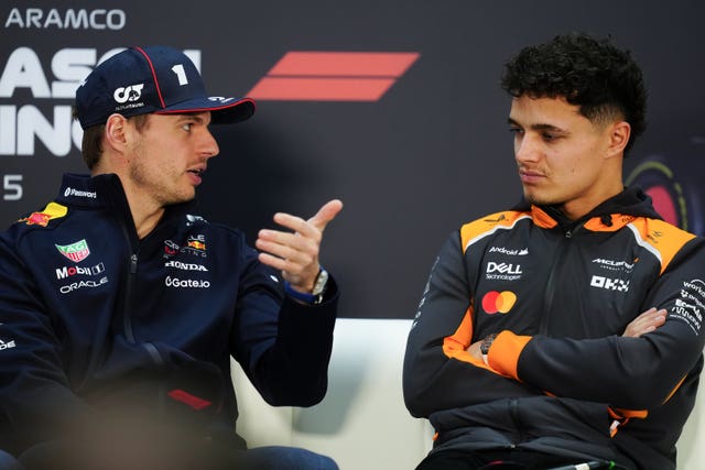 Max Verstappen (left) chats wth Lando Norris