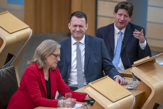 Russell Findlay seated in the Holyrood chamber