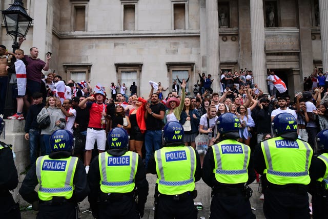 Metropolitan police officers observe England fans during the Euro 2020 final