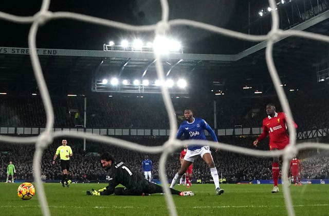 Beto slides the ball past Alisson Becker