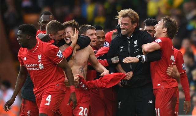 Liverpool's Adam Lallana celebrates with his team-mates and manager Jurgen Klopp