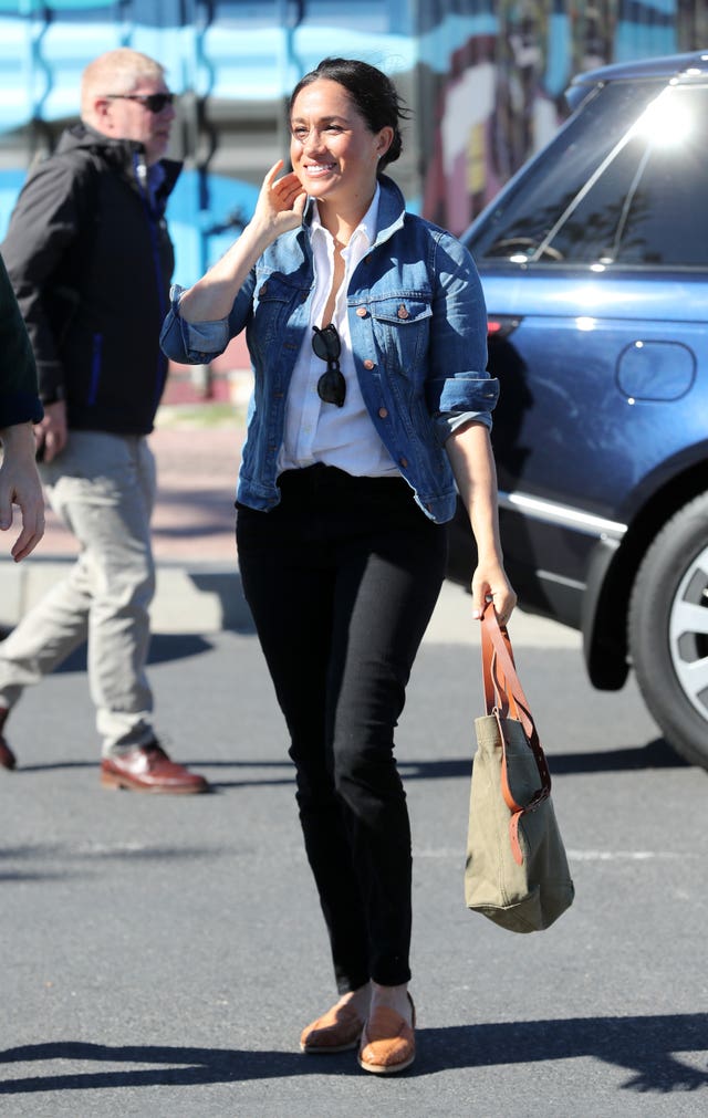 The Duchess of Sussex arrives for a visit to Waves for Change at Monwabisi Beach in Cape Town, on day two of the royal tour of Africa. 