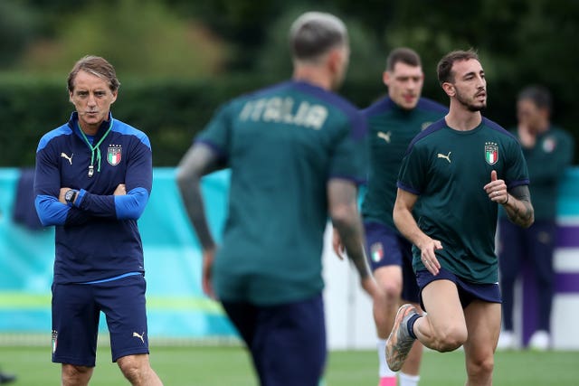 Italy manager Roberto Mancini (left) with his players during a training session at Tottenham Hotspur's training ground.