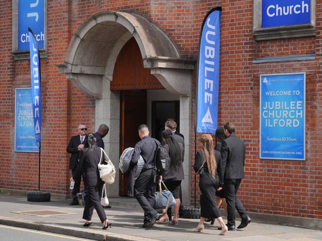 Mourners arrive at Jubilee Church in Ilford 