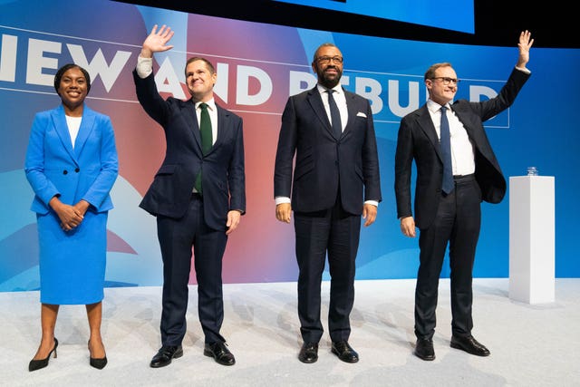 Kemi Badenoch, Robert Jenrick, James Cleverly and Tom Tugendhat stand on stage at the Conservative Party conference