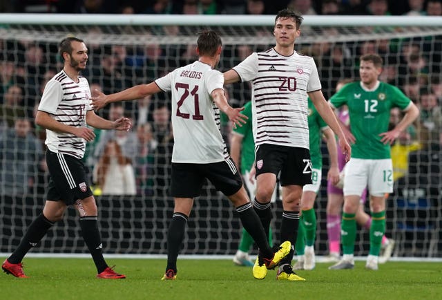 Latvia’s Roberts Uldrikis (right) celebrates scoring his sides first goal against the Republic of Ireland with a superb long-range strike