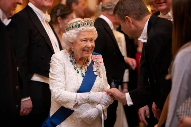 The Queen speaks to guests at the event on Wednesday (Victoria Jones/PA)