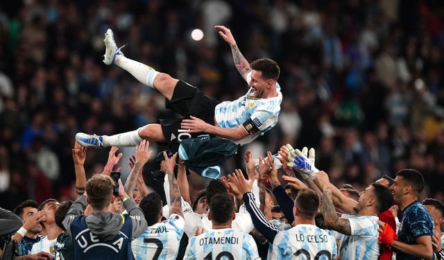 Argentina throw Lionel Messi in the air