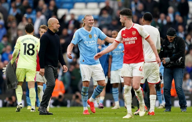 Erling Haaland speaks with Declan Rice