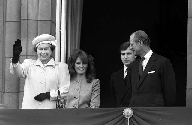 The Queen, Andrew's then fiancee Sarah Ferguson, Prince Andrew and the Duke of Edinburgh on the palace balcony (PA)