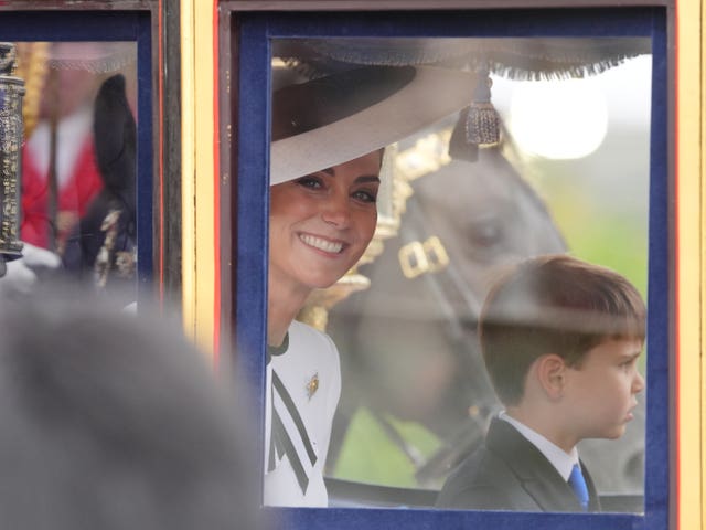 Kate and Louis travel in a carriage along The Mall to the Trooping the Colour ceremony in June 