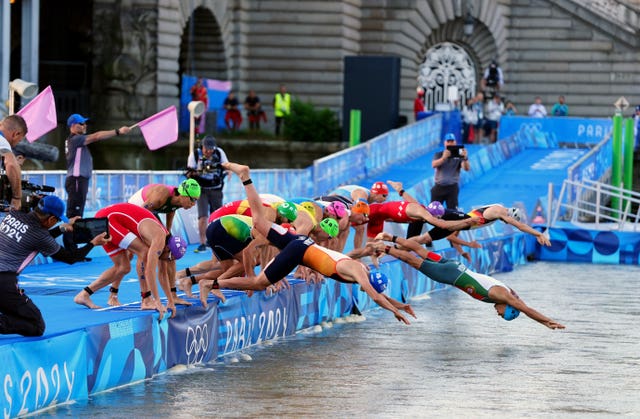 Athletes enter the River Seine