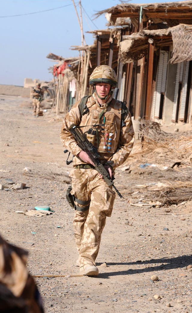 Prince Harry on patrol through the deserted town of Garmisir in Helmand province, Afghanistan (John Stillwell/PA)