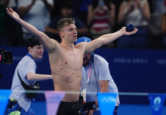 Leon Marchand celebrates winning gold in the men's 200 metres individual medley