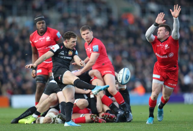 Exeter's Nic White clears from a ruck 