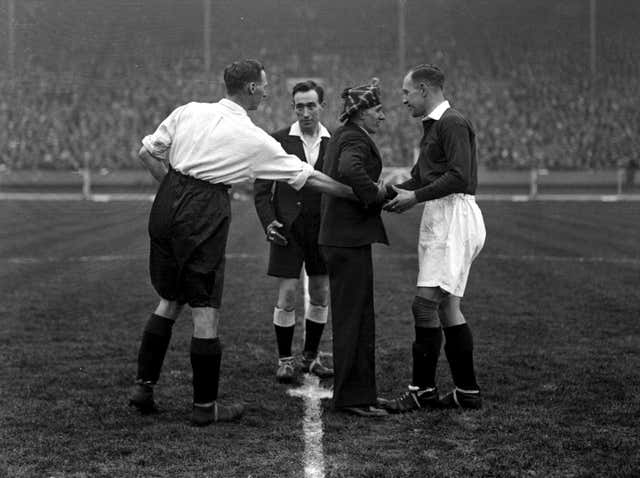 England captain David Jack, left, shakes hands with Scotland counterpart David Meiklejohn before kick-off in April 1930